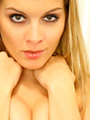 "Naomi dressed as a secretary in a tight green blouse and long black skirt. "